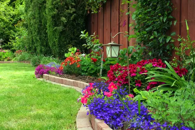 Brick edging along a flowering garden bed